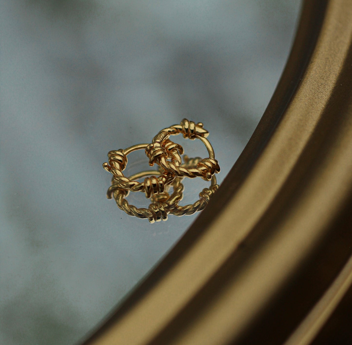 Boucles d’oreilles barbelées